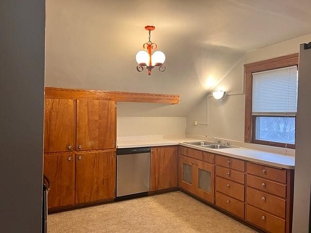 Kitchen includes stainless steel appliances, microwave and dishwasher.