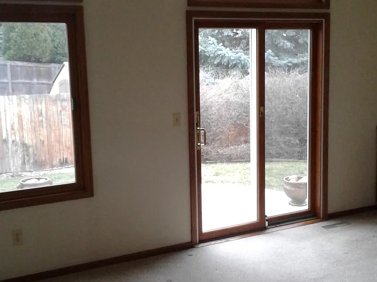 Family room with sliding glass door that goes out to the beautiful backyard and patio.
