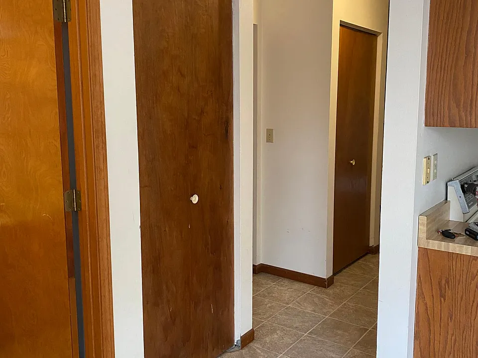 Half bath doorway, pantry, storage, coat closet