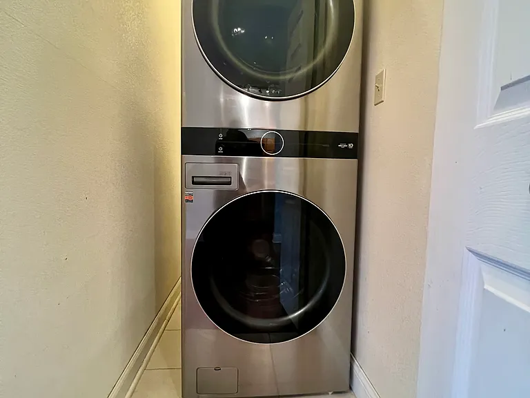 in unit laundry. plenty of room on the side for mops and brooms as well as in front for shelves.