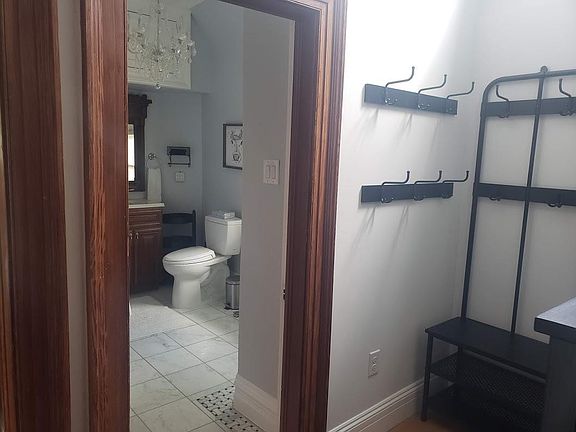 Main Floor Bathroom - location off apartment entry for privacy