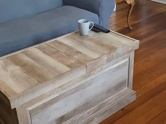 Living room showing beaming hard wood refinished floors. Stunning!