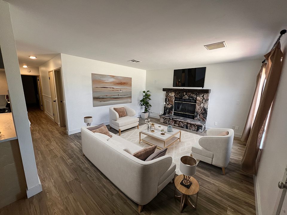 Spacious living room with large windows for natural light.