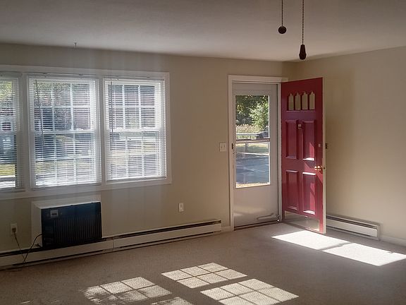 Spacious living/dining area that has been recently painted.