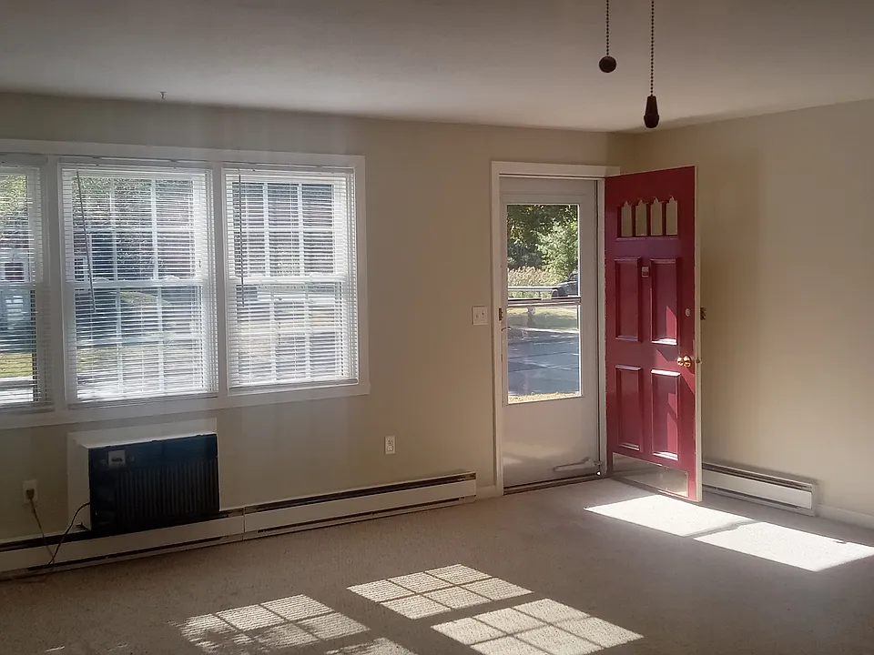 Spacious living/dining area that has been recently painted.