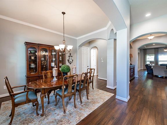 Formal dining room located just inside the front door. Beautiful Pecan wood floors throughout.