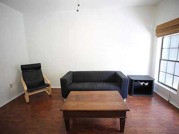 Landlord provides a sofa, a coffee table and an IKEA signature-design chair.
