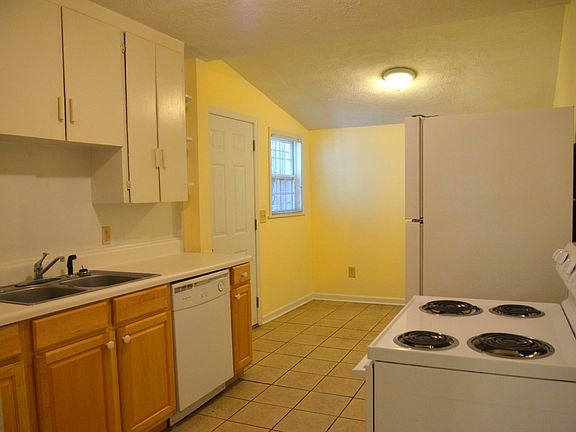 Kitchen with refrigerator, stove & oven