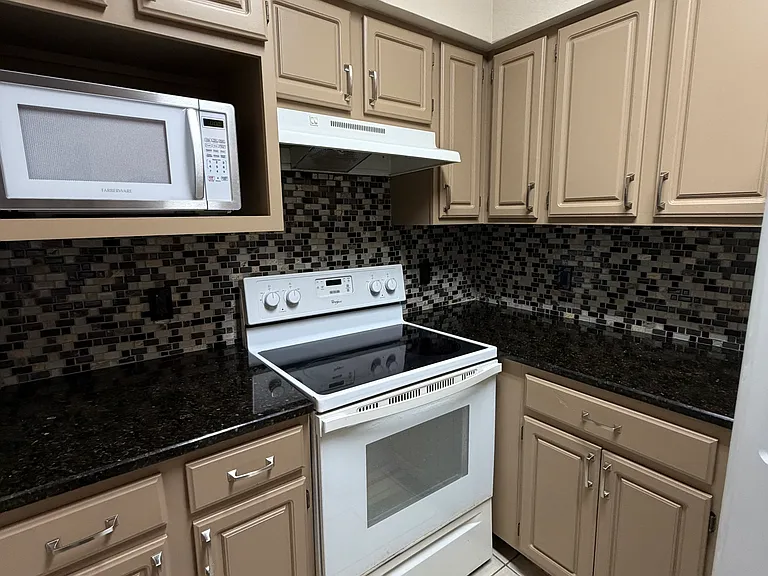 Ample cabinet space around the cooking area.