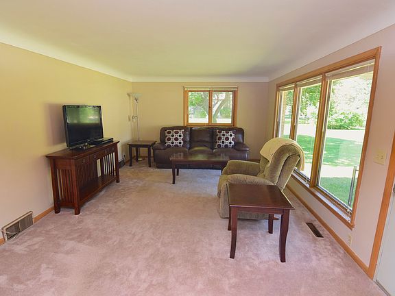 Huge living room with a tons of natural light pouring in