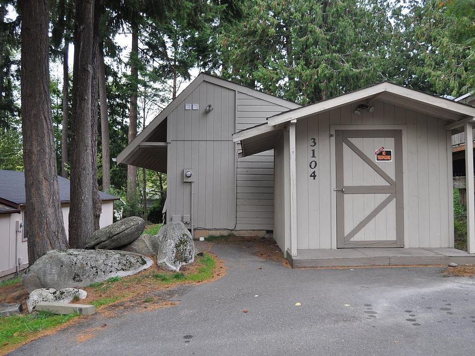 Front of home with storage shed