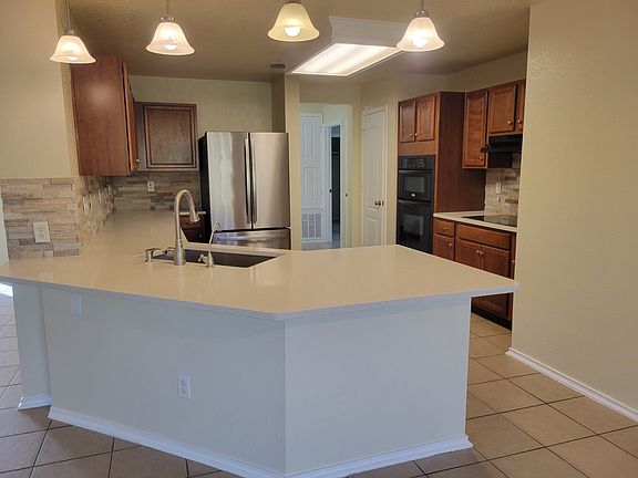 Well-appointed kitchen with plenty of cabinet and counter space for everyday cooking.