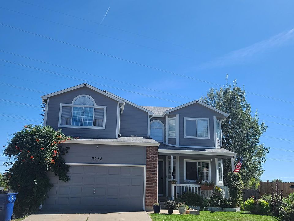 view of the front of the house with plants in bloom