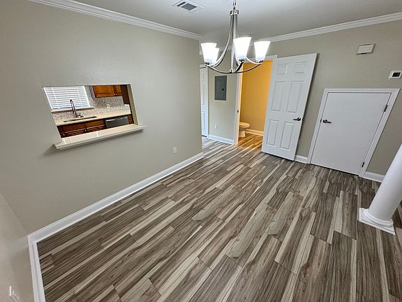 Dining Room, door to half bath, & door to under stairs storage.