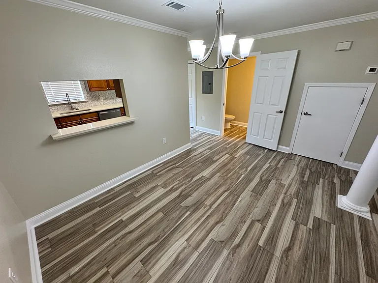 Dining Room, door to half bath, & door to under stairs storage.