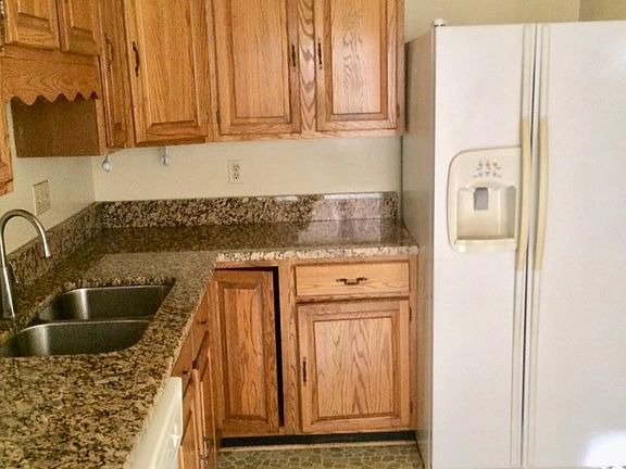 Kitchen with granite counters.