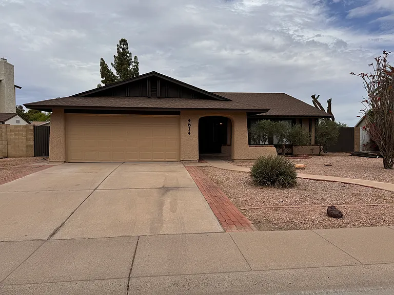 Street View...property has RV gate with pad, front portico/porch, 2-car garage