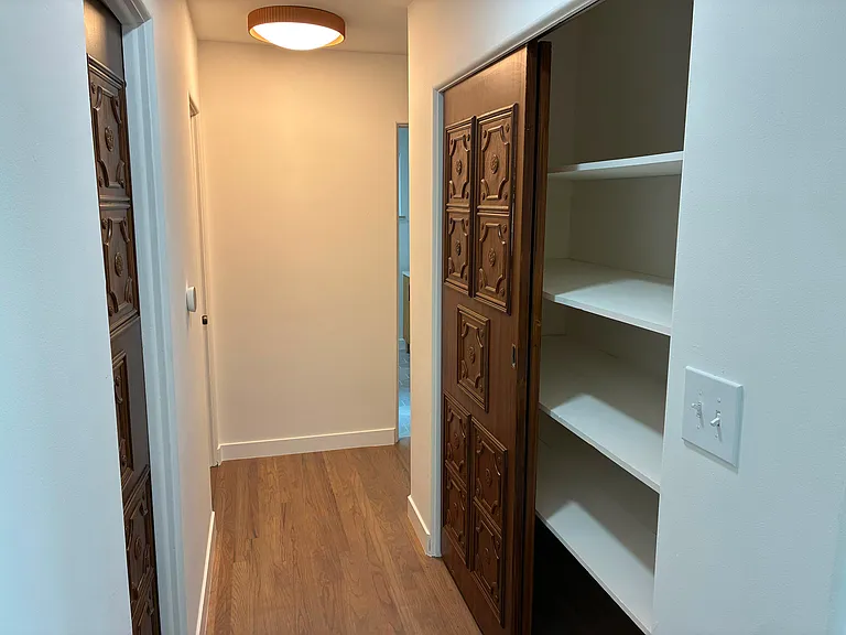 Passage with linen closet