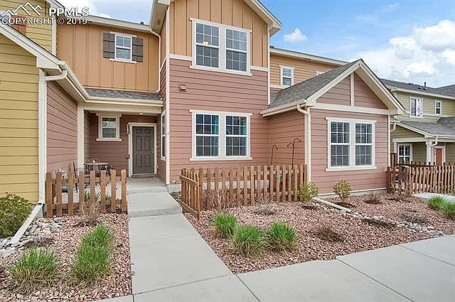 Lovely west facing fenced front porch.