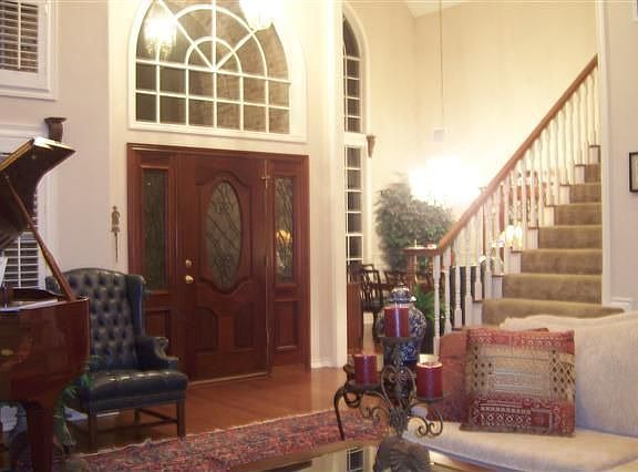 Formal living and dining rooms with antique entrance