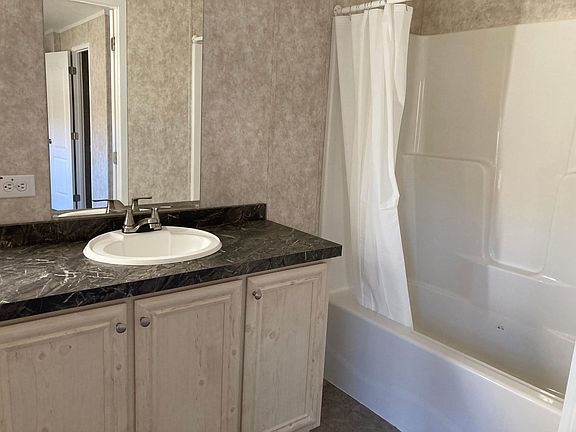 Master bath with tub and shower.