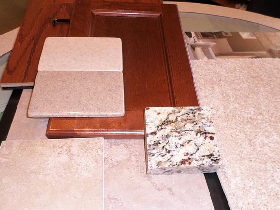 Hardwood flooring, cabinet, granite, bathroom counters & tile, plus carpet selected for this home