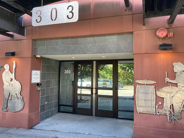 Main entrance includes a call box and keyed entry. Additional entrance from secure garage.