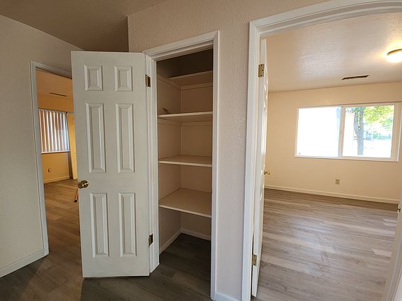 hallway closet & view of bedrooms_08162024