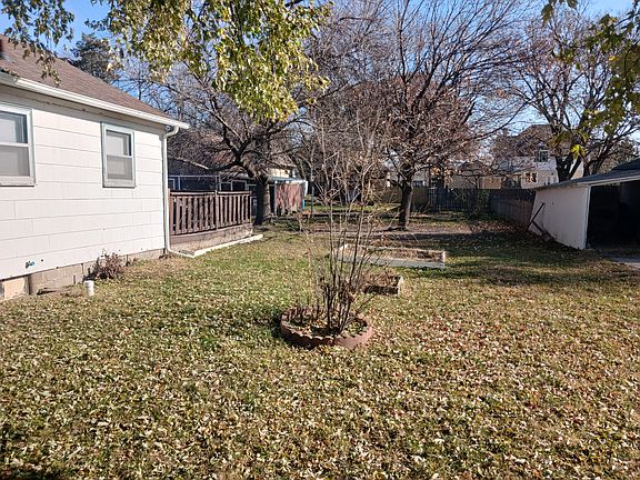 South side of house with deck and raised beds