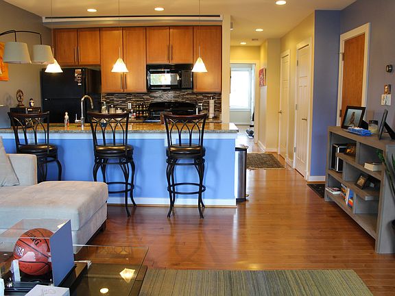 Living room, kitchen, and hallway.