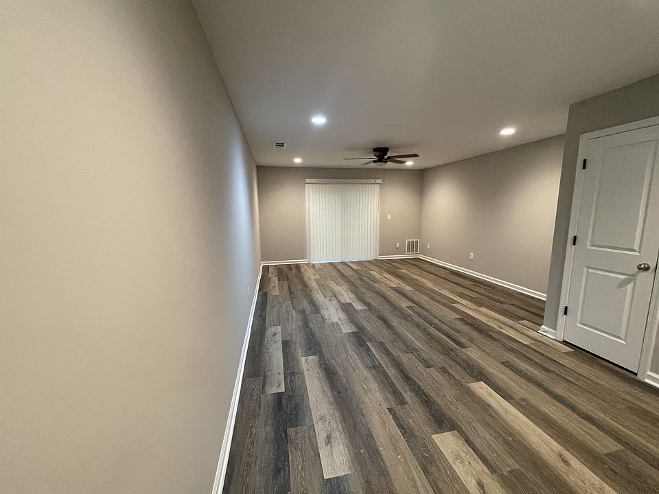 Living area (open floor plan, view from kitchen seating area)
