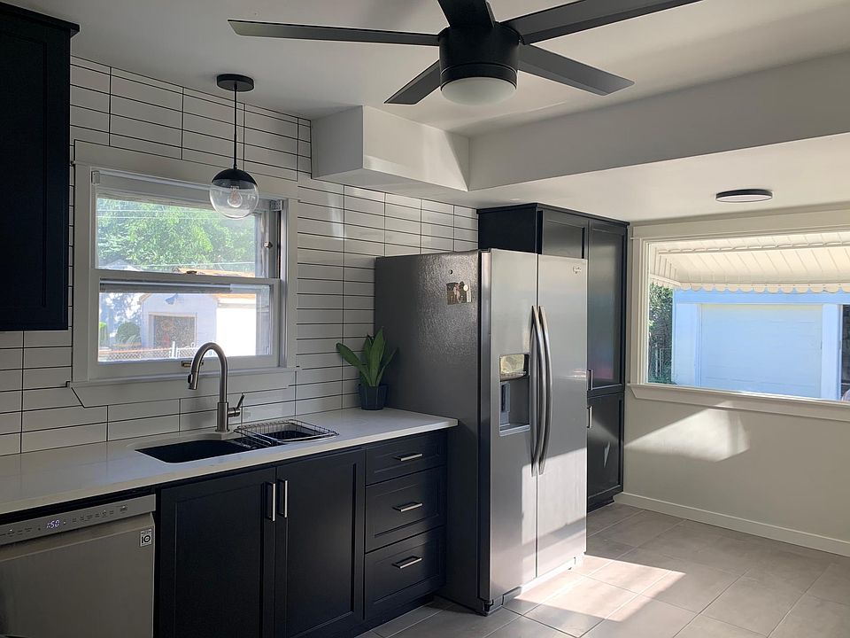 Completely renovated Kitchen. Custom black cabinets, white quartz countertop, all new stainless steel appliances.