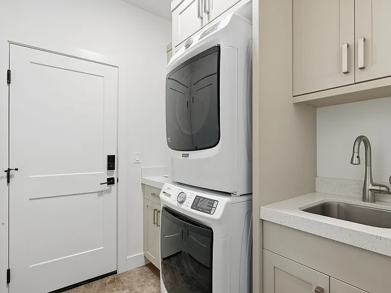 Mudroom with washer and dryer and storage