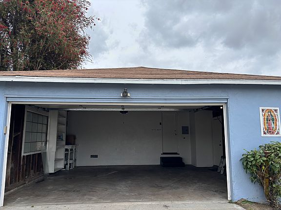 2-car garage with washer/dryer hook up on the wall to the right. Door leads to kitchen.
