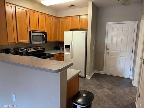 5th image of 7108 W Friendly Ave Unit 311