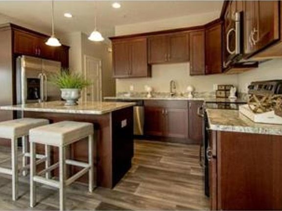 Photos of previously sold unit by same builder. Subject property to have similar finishes.