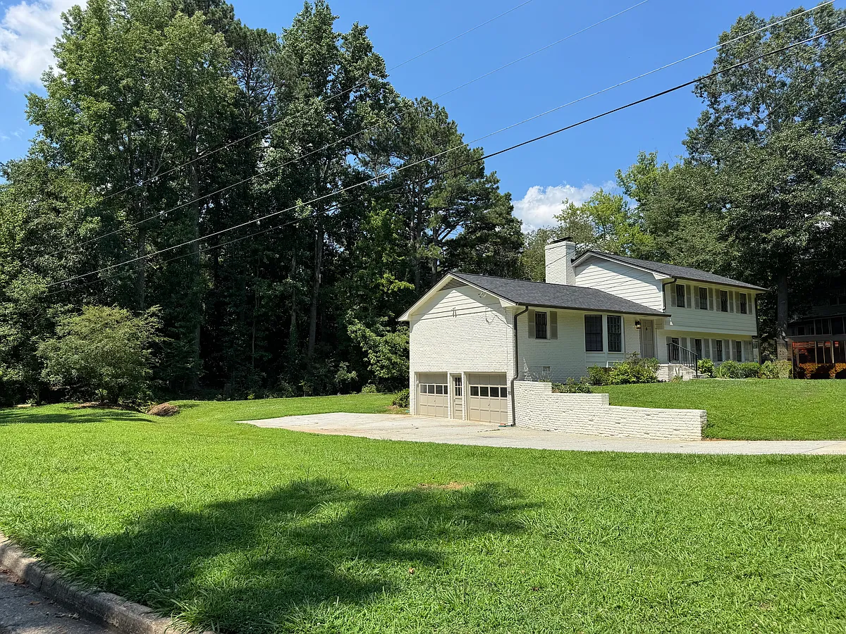 On a huge corner lot with a spacious driveway, 2 car garage and EV charger. - 5599 Bend Creek Rd
