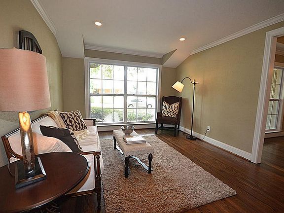 Living room with wood floors and crown molding