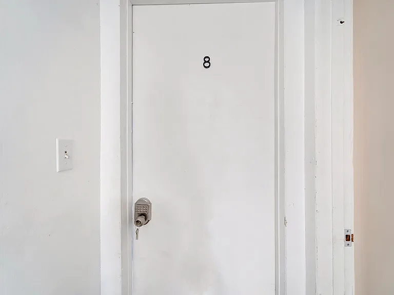 Bedroom #8 located off of hallway