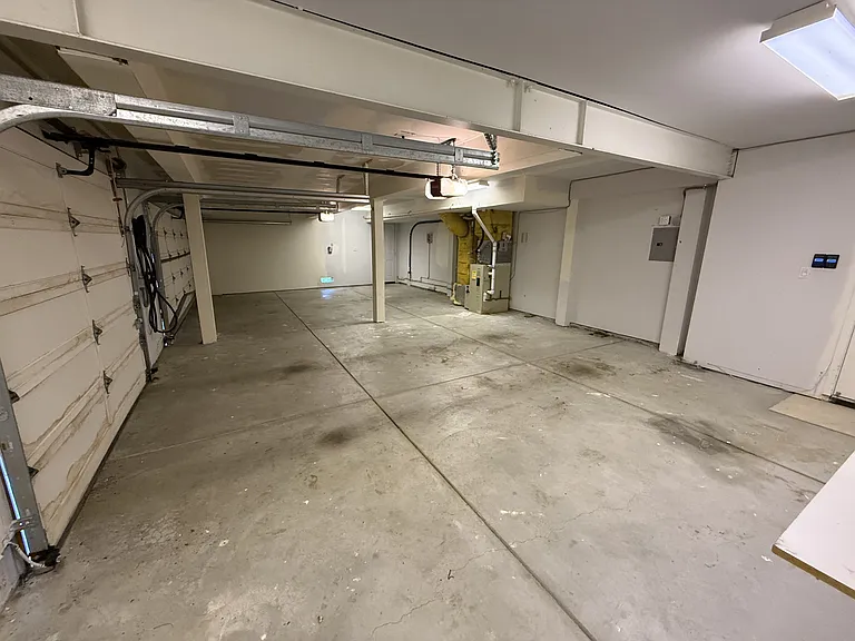 Attached three-car garage is equipped with an EV charger.