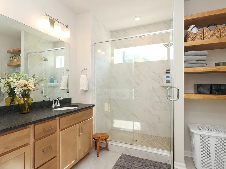 Large, upgraded master bathroom with additional storage