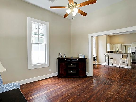 Another view of the living room, open to the dining room. All of the windows are operable!