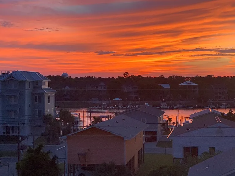 Balcony view of harbor at sunset