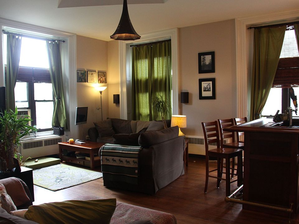 Living Room w/ view of phonograph chandelier, custom window dressings