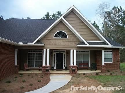 Kitchen with custom built cabinets.
						:
						Granite counter tops, porcelain tile floor, and stainless steel appliances.