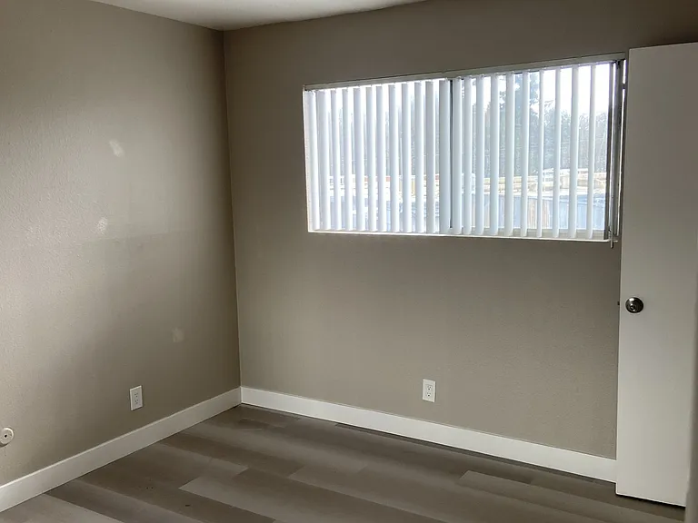 Luxury two-tone paint flows throughout this apartment, paired with bright natural light in the bedroom and updated light flooring for an open, airy feel. High ceilings offer maximum decorating flexibility.