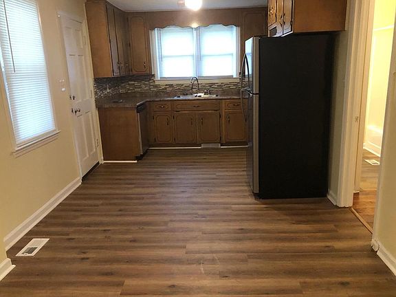 KITCHEN HAS ALL NEW APPLIANCES, One Year Old AND LAMINATE VINYL FLOORS.