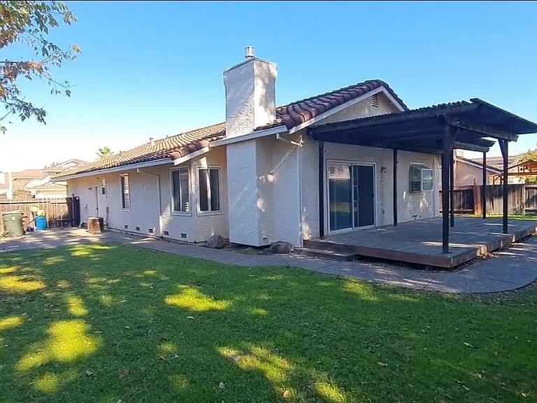 Deck as seen from the large yard, is off of the living room