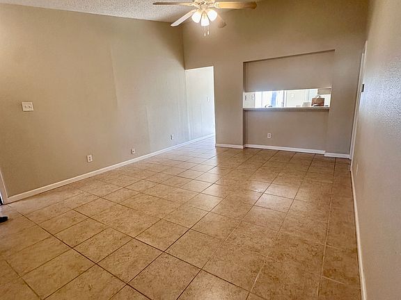 Enjoy a spacious living room with vaulted ceilings
