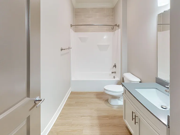 The Presley floor plan has two spacious bathrooms with vanity sinks, wood-style flooring, and shower/bathrub combos. The Presley floor plan has two spacious bathrooms with vanity sinks, wood-style flooring, and shower/bathrub combos.